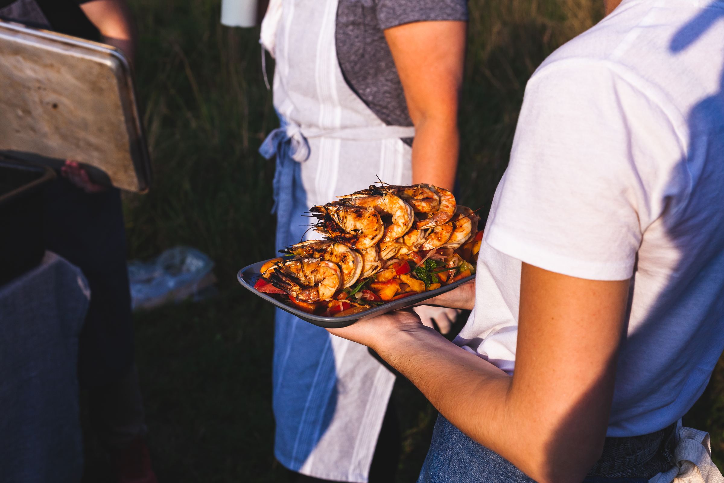 A tray of grilled prawns served at the farm